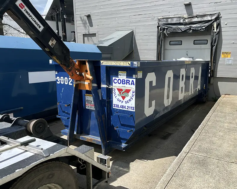30 yard dumpster placed at a commercial loading dock