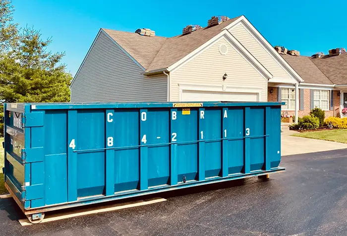 Dumpster showing driveway protection